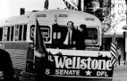November 2, 1990 Paul and Sheila Wellstone waved from the back of their campaign bus as they left the Rochester Radisson Hotel after Wellstone's press
