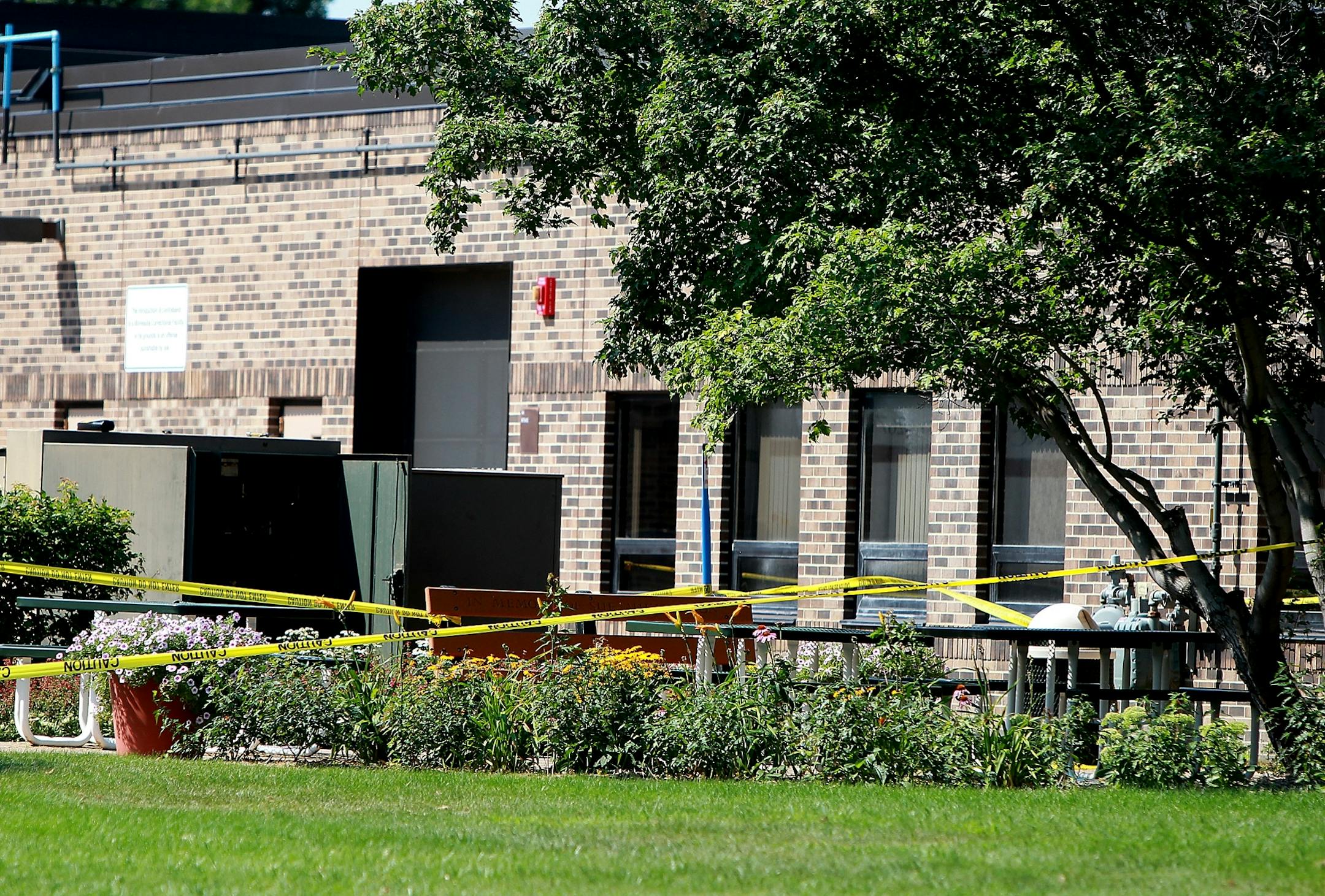 Police tape marked an area outside the Minnesota Correctional Facility in Shakopee, Monday, where four utility workers were injured.