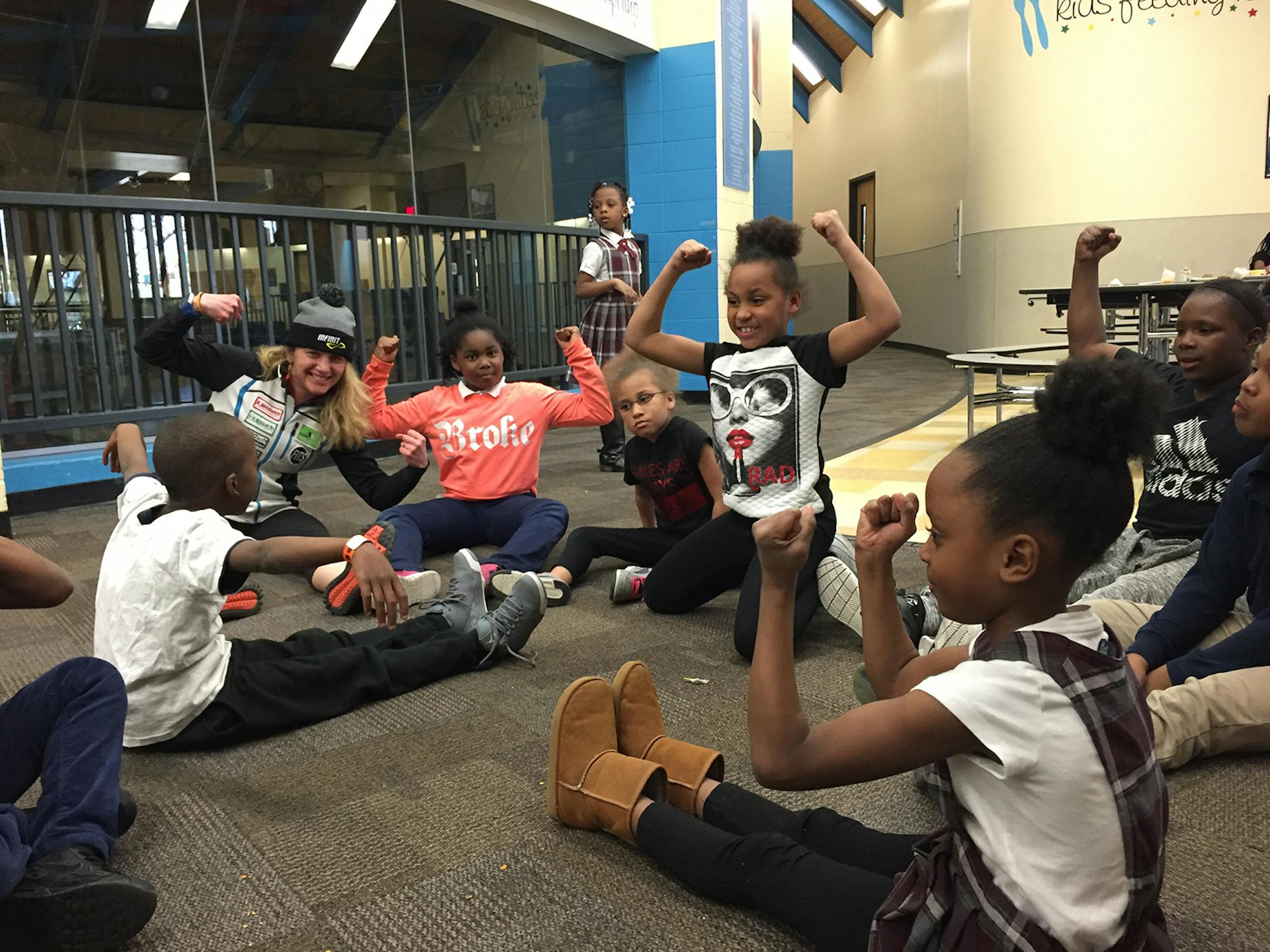 Caitlin Gregg, left, with children in the Jerry Gamble Boys and Girls Club Run Club