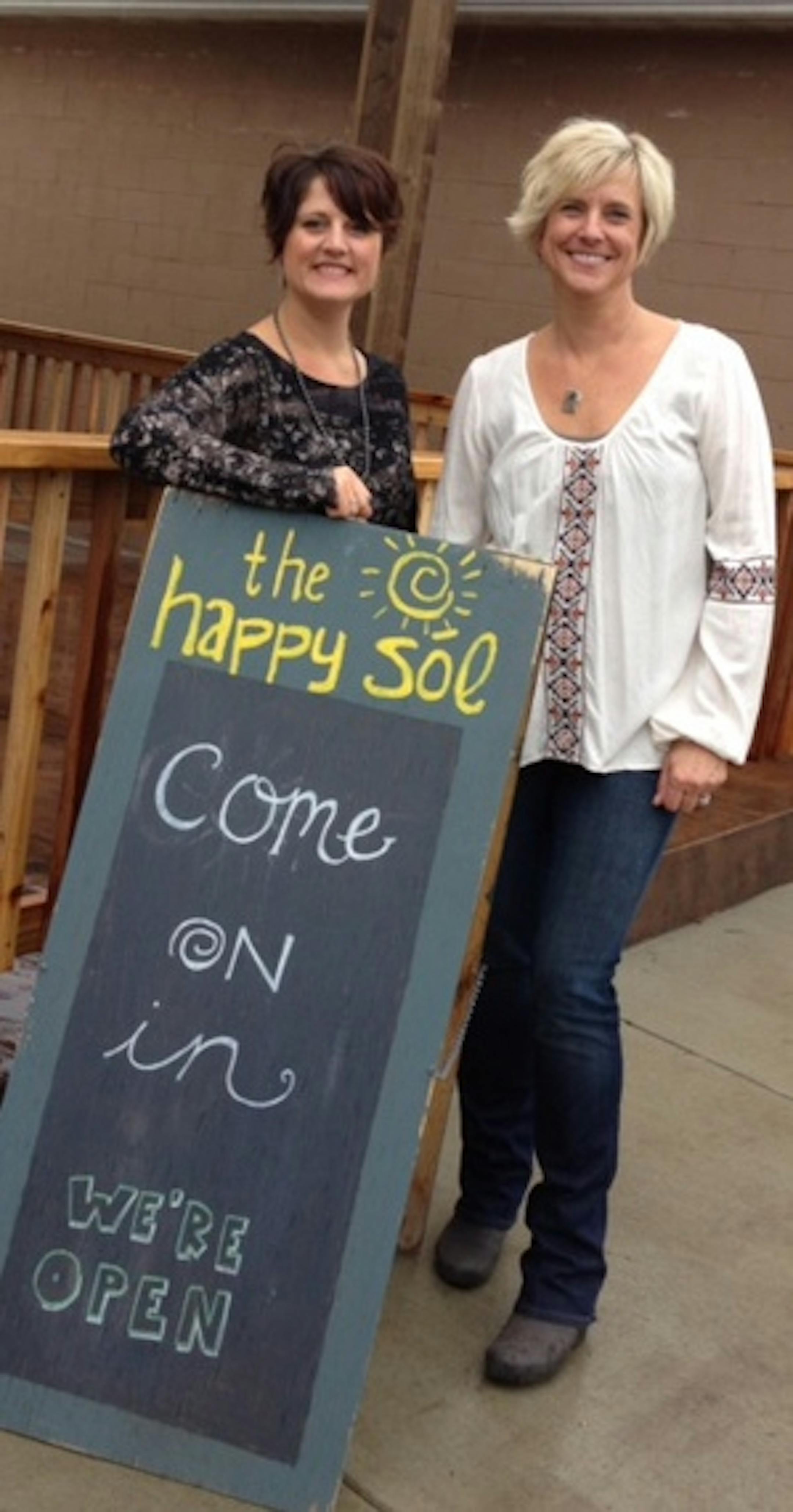 Gina Lieser, left, and Stacey Roberts, right, pictured at their clothing business in New London.
