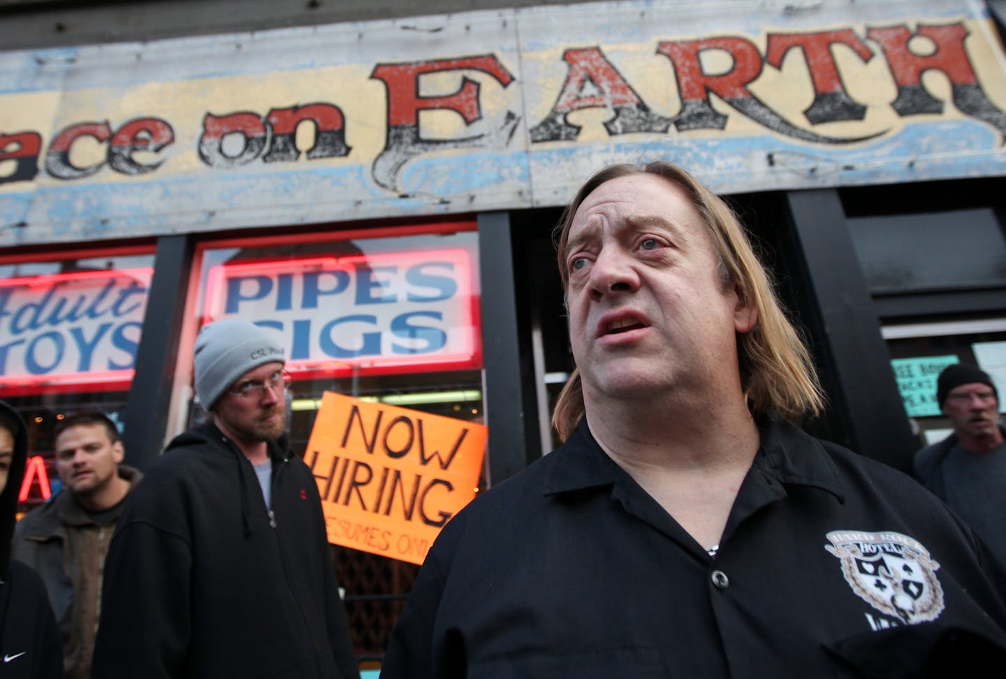 The Last Place On Earth owner Jim Carlson talked with reporters outside his head shop in Duluth in 2011.