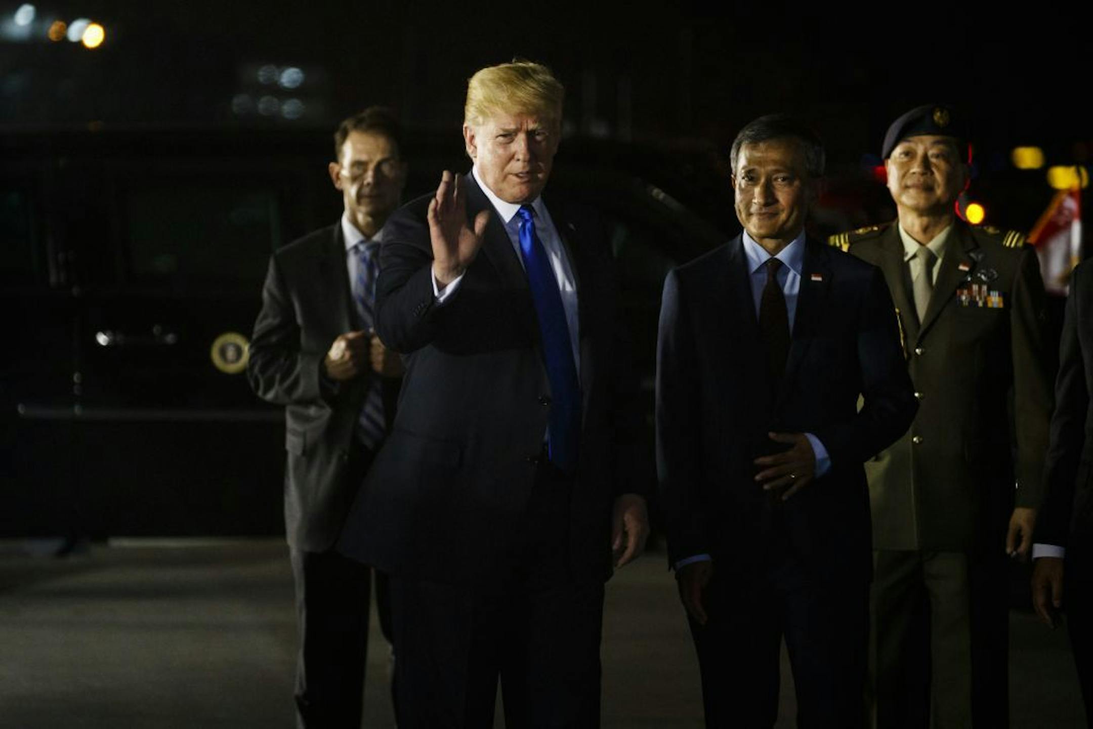 President Donald Trump arrives at Paya Lebar Air Base for a summit with North Korean leader Kim Jong Un, Sunday, June 10, 2018, in Singapore.