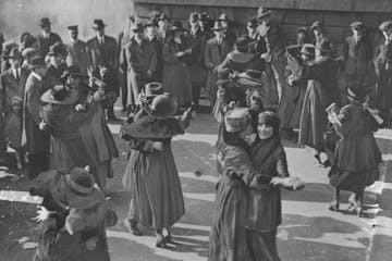 People danced in the streets of New York (above) and other cities, blew horns and shouted "the war is over" by way of celebrating the Armistice ending