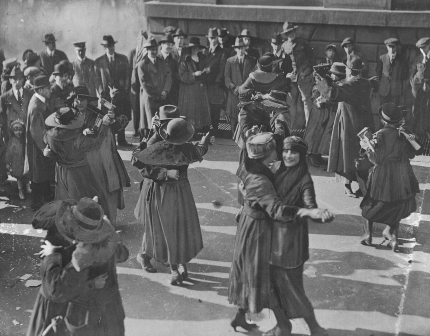 People danced in the streets of New York (above) and other cities, blew horns and shouted "the war is over" by way of celebrating the Armistice ending world war I. Says Allen: "Thus began the period between the wars, which was to last 23 years and 26 days." Note the "new look." Associated Press Photo