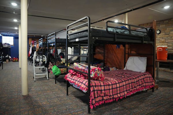 Bunk beds provide sleeping space in the women’s dorm inside the former Zion Lutheran Church utilized by Simpson Housing Services as a temporary home