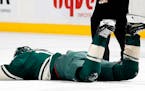 Zach Parise (11) was hit in the face with a high stick by Tom Wilson in the first period. ] CARLOS GONZALEZ • cgonzalez@startribune.com - March 28, 