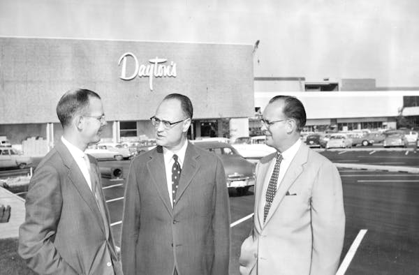 Bruce Dayton, left, talked with Prudential executives outside Southdale Mall in 1956. Dayton's was the key anchor tenant when the first enclosed mall 