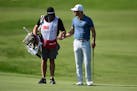 Matthew Wolff, right, talks with his caddie during the second round of the 3M Open on Friday, July 24, 2020, at TPC Twin Cities in Blaine, Minnesota. 