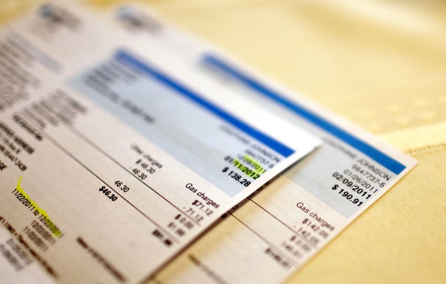 Utility bills are shown in this Jan. 11, 2012 file photo. CenterPoint Energy is seeking at 6.4 percent rate hike in Minnesota.