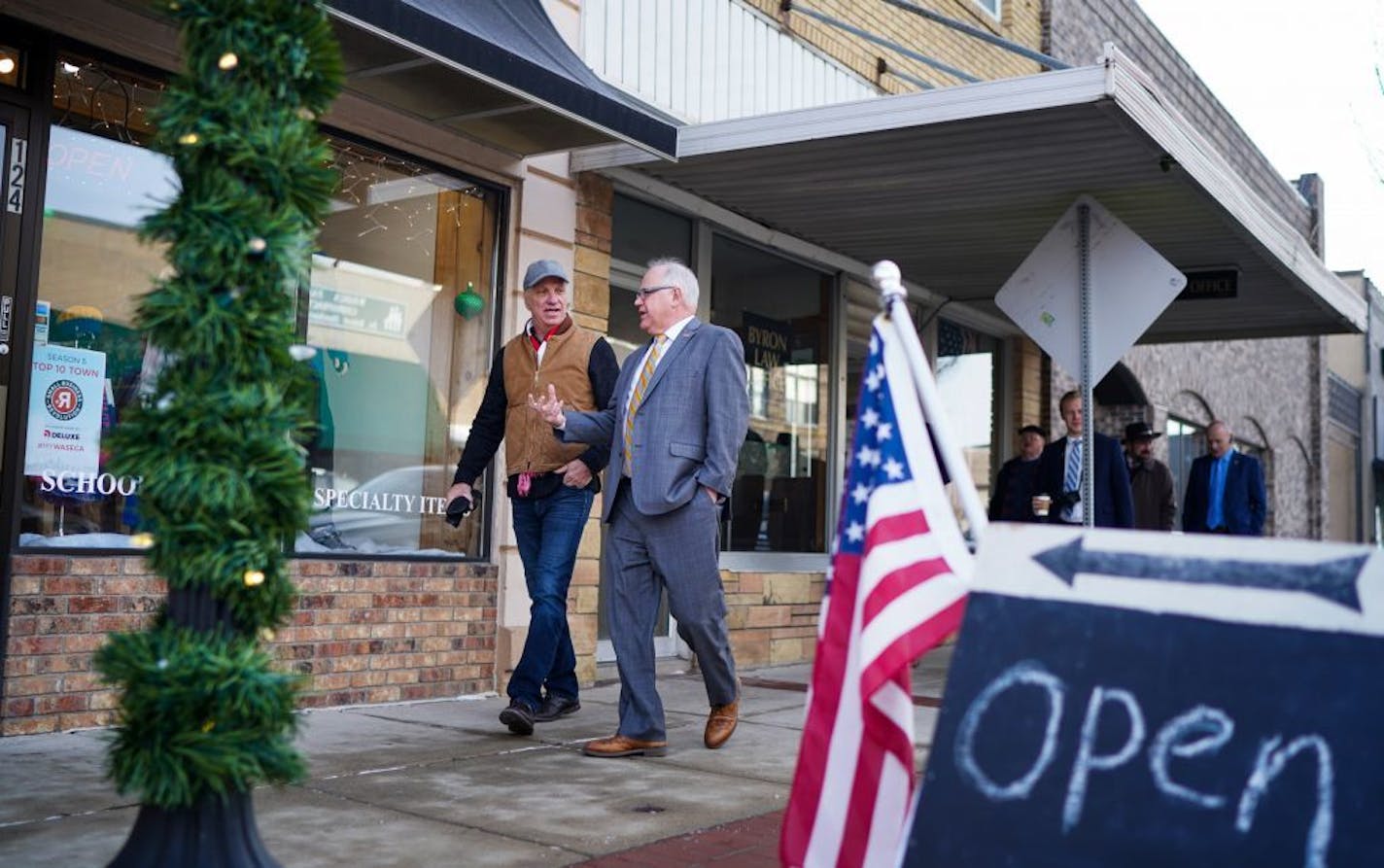 While touring Waseca businesses with Mayor Roy Srp, left, Minnesota Governor Tim Walz headed to 4-Season's Athletics on North State St.