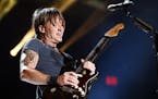 Keith Urban performs at LP Field at the CMA Music Festival on Sunday, June 14, 2015, in Nashville, Tenn.