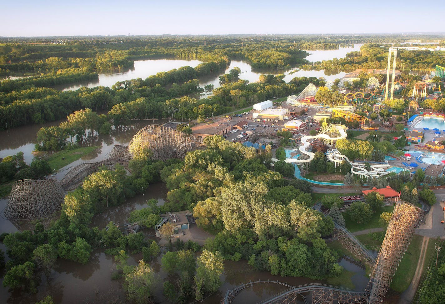 This aerial photo shows floodwaters from the Minnesota River encroaching on Valleyfair, forcing the closure of three rides.