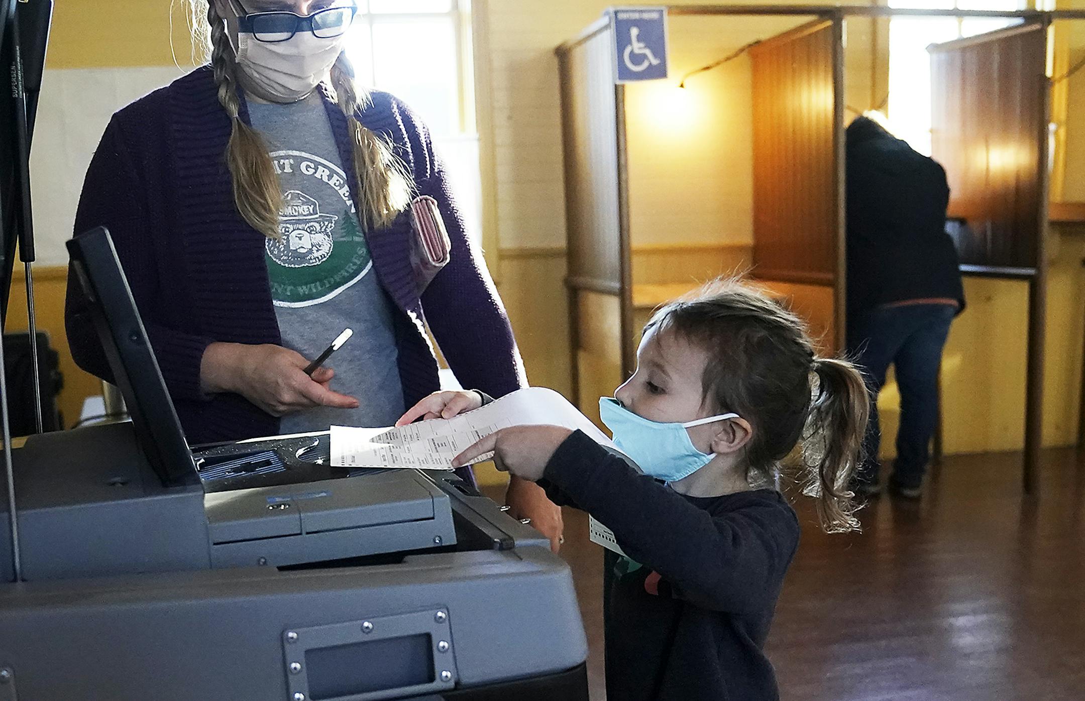 Laura Gesme of Vasa got help from daughter Isla, 4, while voting Tuesday at the Vasa Town Hall in Welch, MN ] DAVID JOLES • david.joles@startribune.com Tuesday, Nov. 3, 2020 in Frontenac, MN election day at rural, bucolic Town Hall locations in Minnesota, including: Franconia Township Town Hall 25156 St. Croix Trail N. Shafer, MN Florence Town Hall 33915 US-61 In Frontenac, MN Vasa Town Hall 15527 Norelius Rd in Welch, MN**Robert and Nancy Herron , Heather Hawk, Joshua Sanders, Laura Gesme, Isla