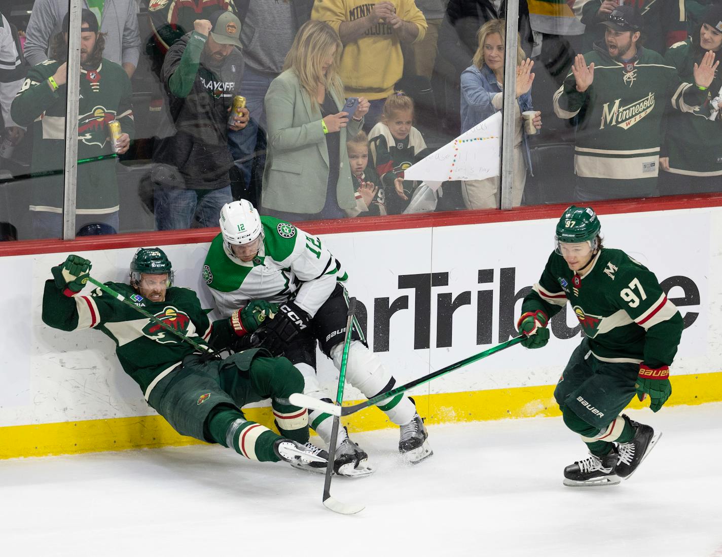 Wild defenseman Jonas Brodin fell to the ice after a check by Dallas center Radek Faksa as Wild left wing Kirill Kaprizov skated past in the third period of Game 6.