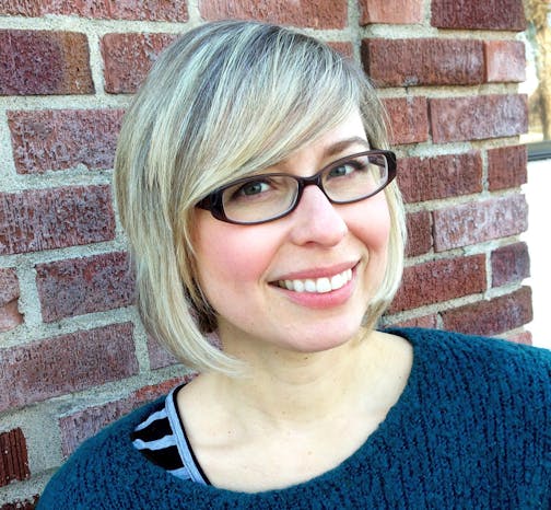 photo of author Cori Doerrfeld in front of a brick wall