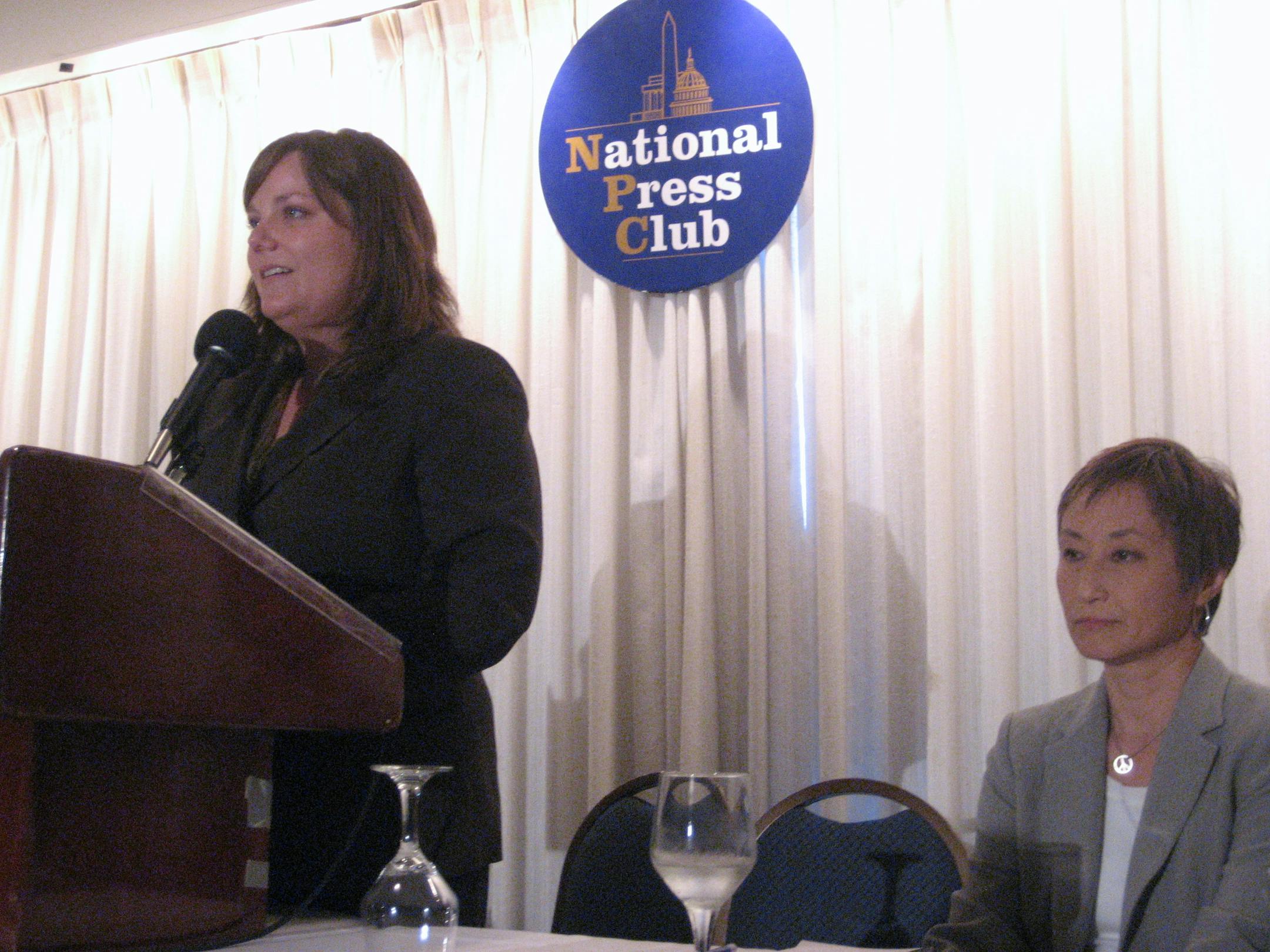 Sarah Erlinder, daughter of St. Paul attorney Peter Erlinder, speaks at a press conference in Washington, D.C., on Thursday, June 3, 2010, as Erlinder's wife Masako Usui looks on.
