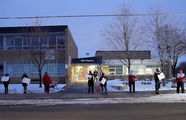 Educators wary about the return of in-person learning turn up in support of staff members at Maxfield Elementary School in St. Paul in February 2021. 