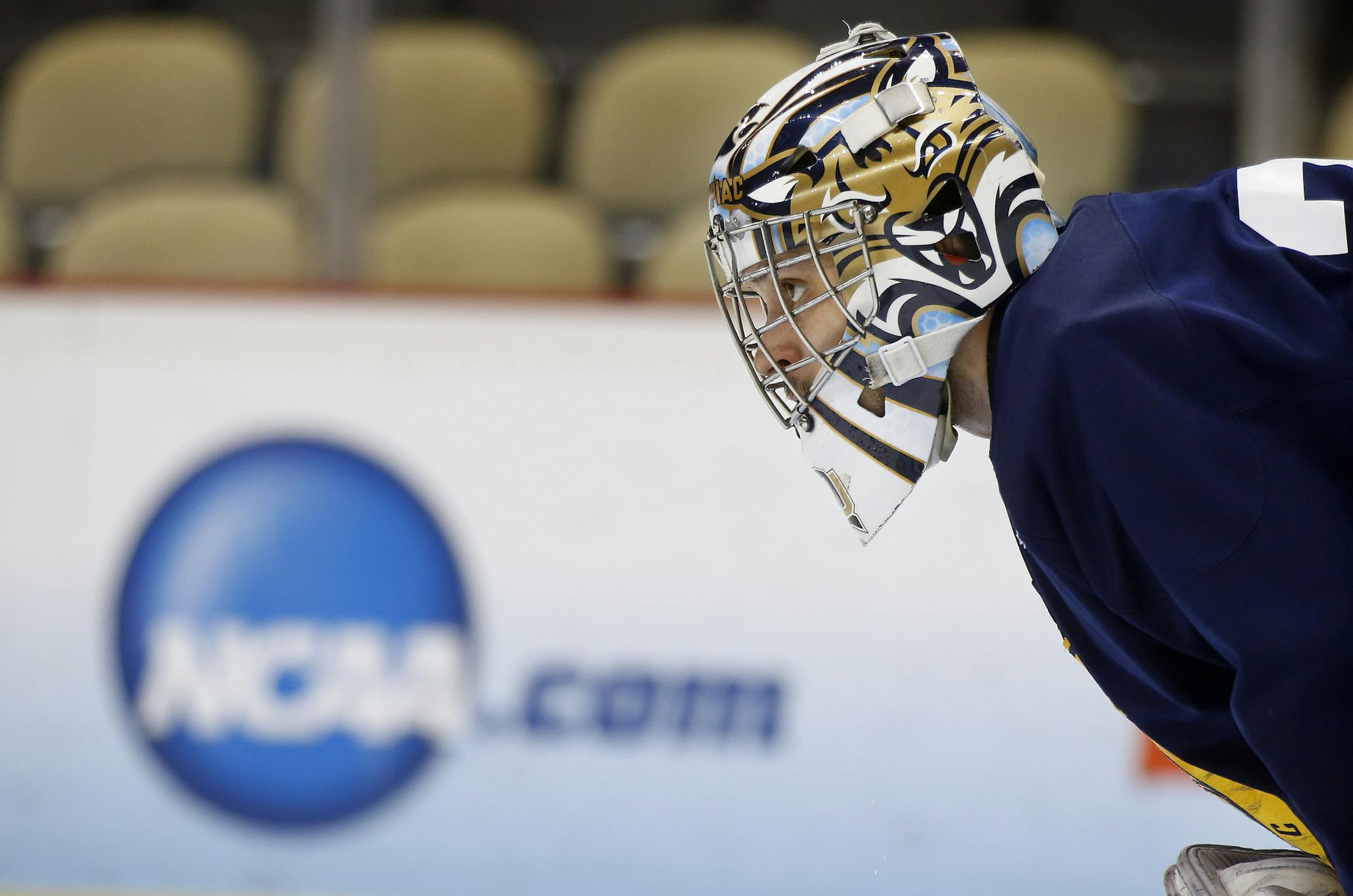 Quinnipiac goalie Eric Hartzell watches during NCAA college hockey practice at the Frozen Four, Friday, April 12, 2013, in Pittsburgh. Quinnipiac plays Yale in the championship game on Saturday. (AP Photo/Keith Srakocic)