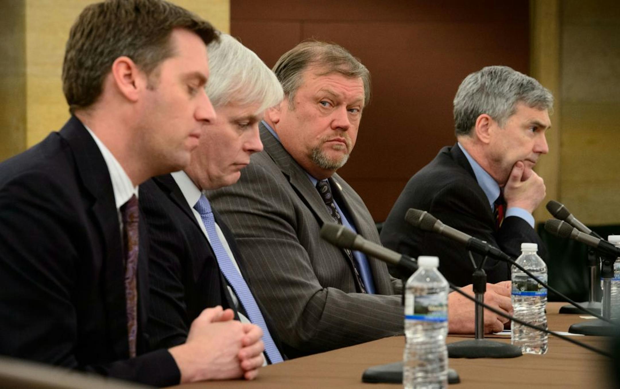 House Minority Leader Kurt Daudt, from left, House Speaker Paul Thissen, Senate Majority Leader Thomas Bakk and Senate Minority Leader David Hann discuss the agenda for the upcoming legislative session, Wednesday, Feb. 19, 2014, in St. Paul, Minn. Democrats who lead the Minnesota Legislature left no doubt that a minimum wage increase of some kind will prevail in the upcoming session.