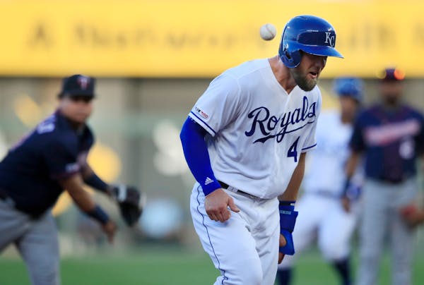 The Royals' Alex Gordon was hit in the helmet by a ball thrown by Twins third baseman Willians Astudillo during the first inning Thursday.