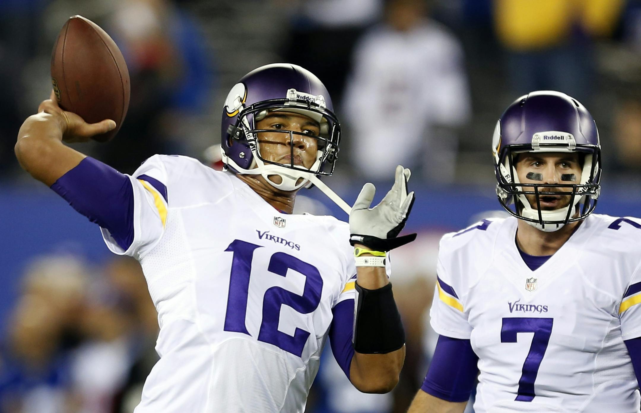 Minnesota Vikings quarterbacks Josh Freeman (12) and Christian Ponder (7)