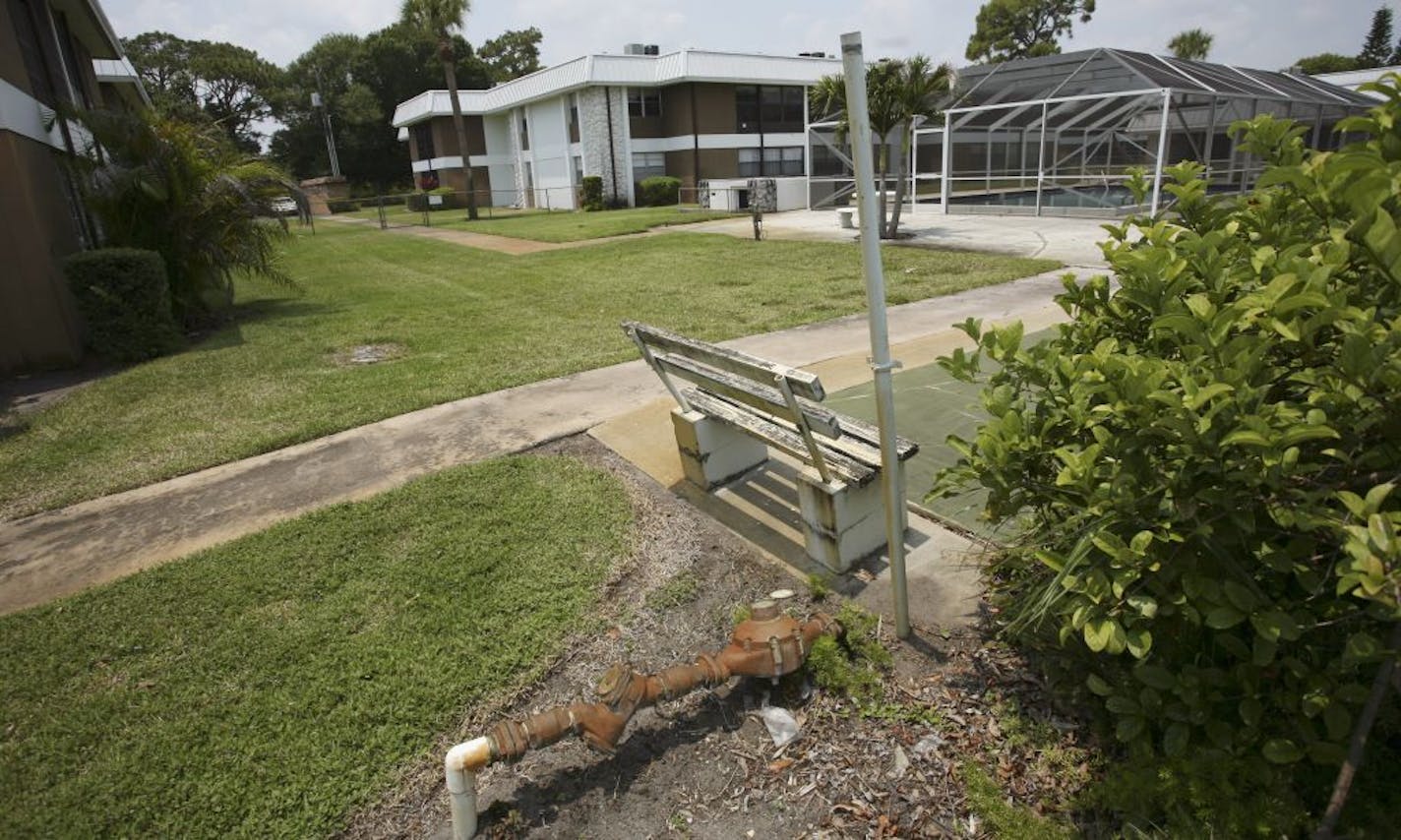 Near the swimming pool at the Inlet House, in Fort Pierce, Fla. The condo owners' association has levied a $6,000 assessment on every homeowner and then foreclosed on seniors who did not owe the bank a dime but couldn't afford the fee.