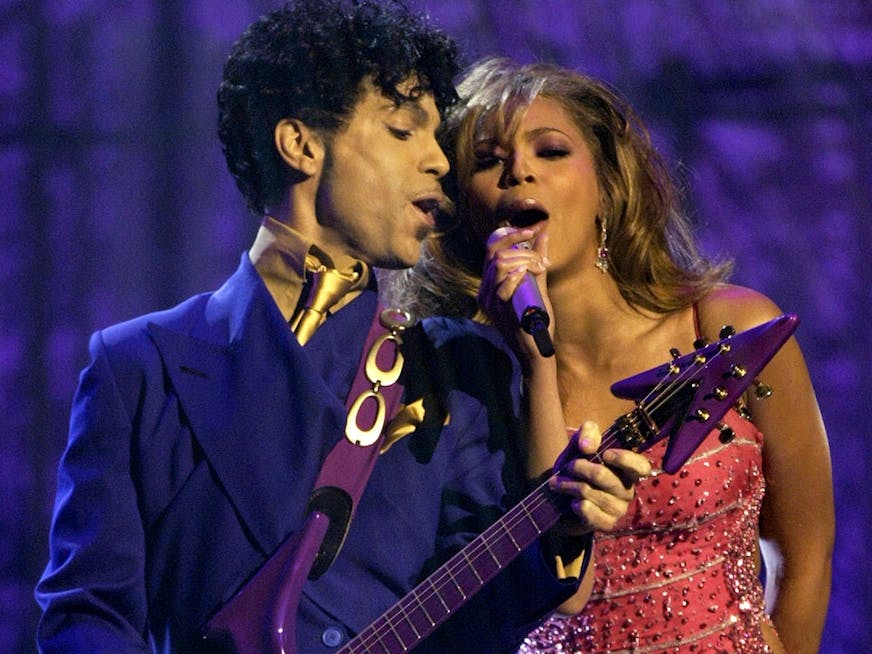 Beyonce, right, and Prince perform during the 46th Annual Grammy Awards, Sunday, Feb. 8, 2004, in Los Angeles. (AP Photo/Kevork Djansezian) ORG XMIT: LAS155