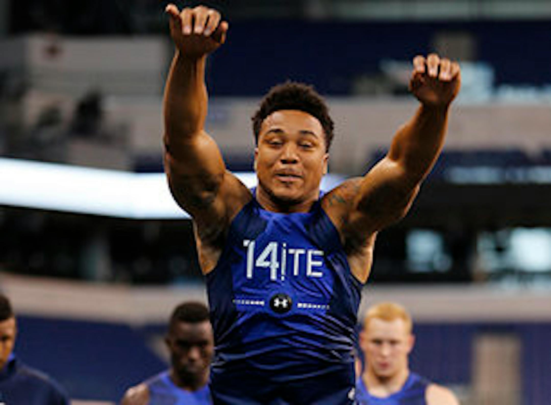 Mycole Pruitt runs a drill at the NFL football scouting combine in Indianapolis, Friday, Feb. 20, 2015. (AP Photo/Julio Cortez)