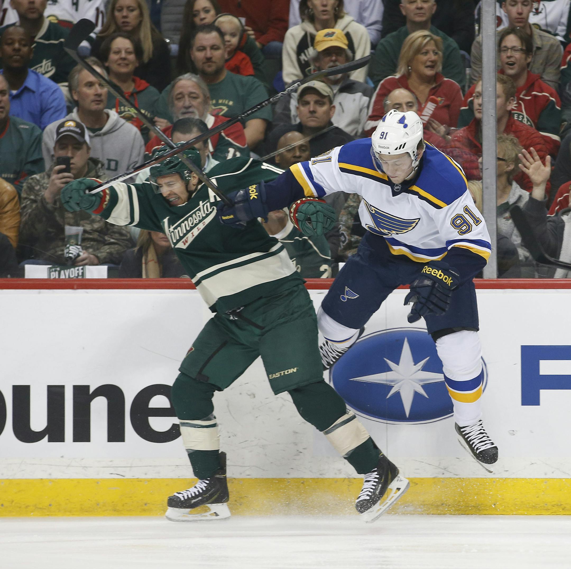 Minnesota Wild left wing Zach Parise (11) and St. Louis Blues right wing Vladimir Tarasenko (91) clash against the boards during the first period. ] CARLOS GONZALEZ cgonzalez@startribune.com, April 22, 2015, St. Paul, Minn., Xcel Energy Center, NHL, Minnesota Wild vs. St. Louis Blues, Game 4, Stanley Cup Playoffs