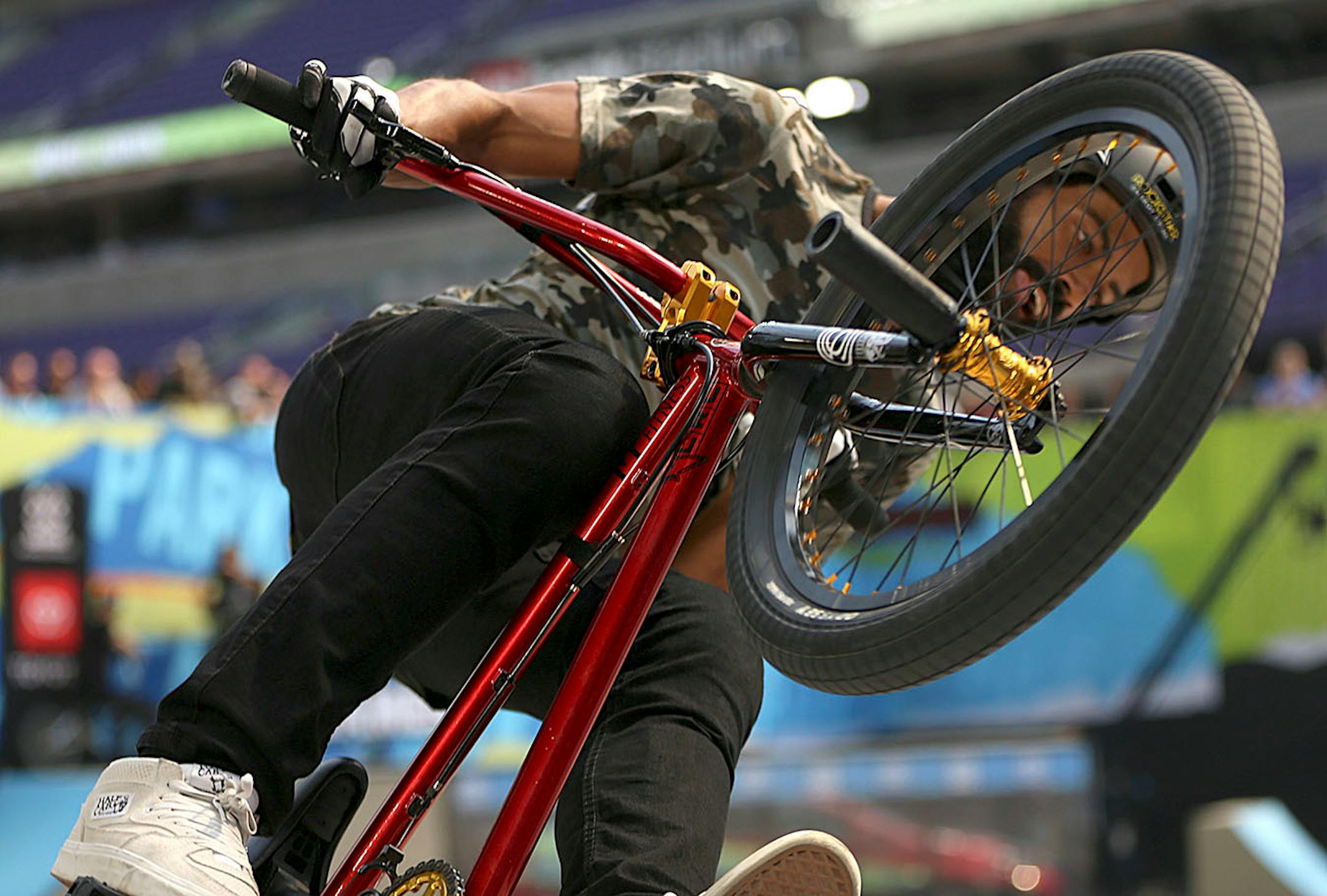 Mykel Larrin catches air with his bike during one of his runs in the men's BMX park final.