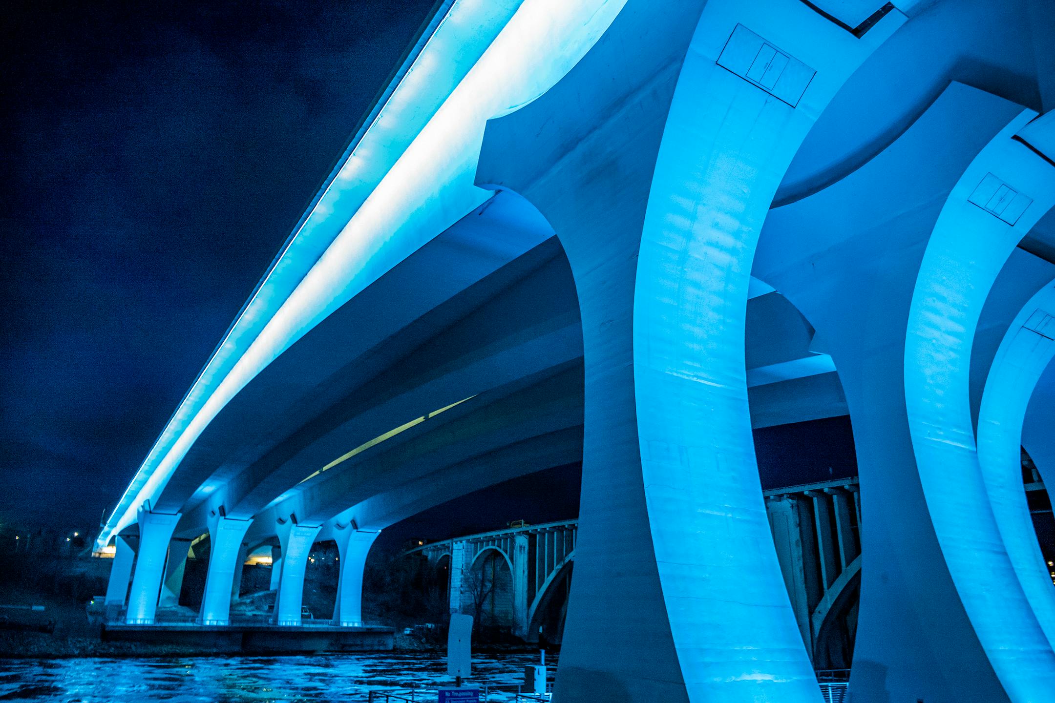 The I-35W bridge in Minneapolis glowed in light blue on April 9, 2020, to honor healthcare providers and essential workers. Other landmarks and buildings in Minnesota and around the world were lit blue to show support and gratitude to workers helping during the COVID-19 pandemic.