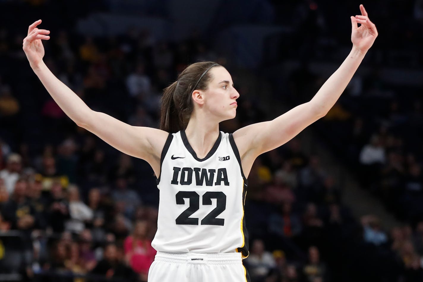 Iowa guard Caitlin Clark calls to the crowd for support after making two intentional foul free throws against Ohio State in the second half of an NCAA college basketball championship game at the Big Ten women's tournament Sunday, March 5, 2023, in Minneapolis. Iowa won 105-72. (AP Photo/Bruce Kluckhohn)