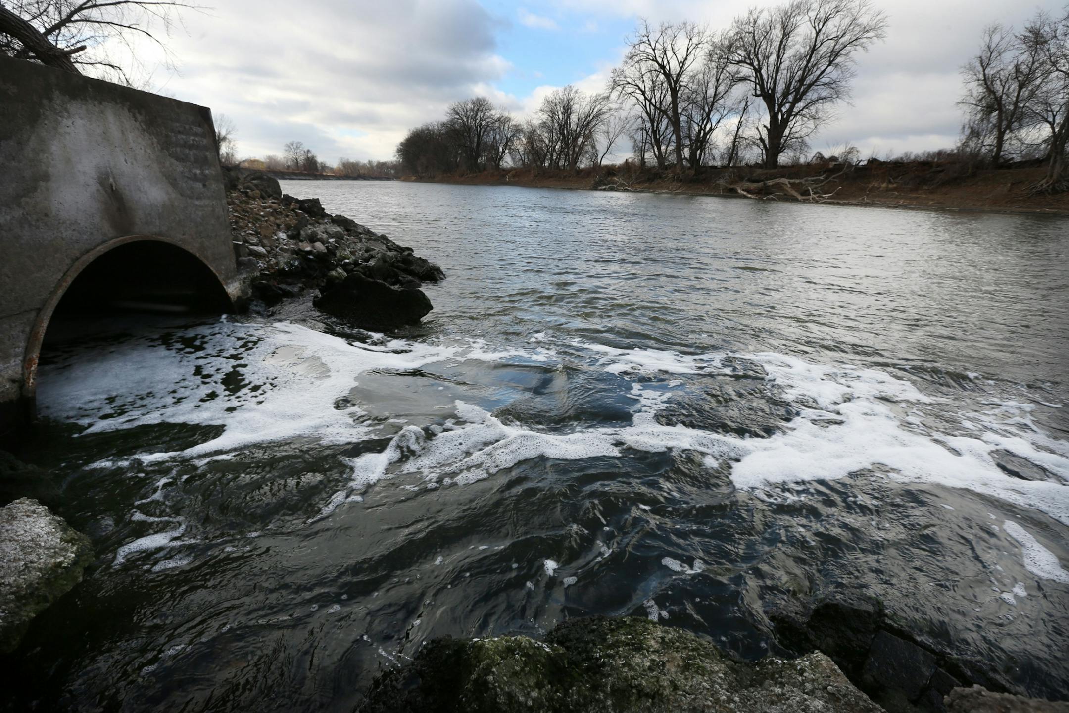 Water flows into the Minnesota River from a pipe that runs from the Blue Lake treatment plant in Shakopee. The plant cleans 28 million gallons of water a day.