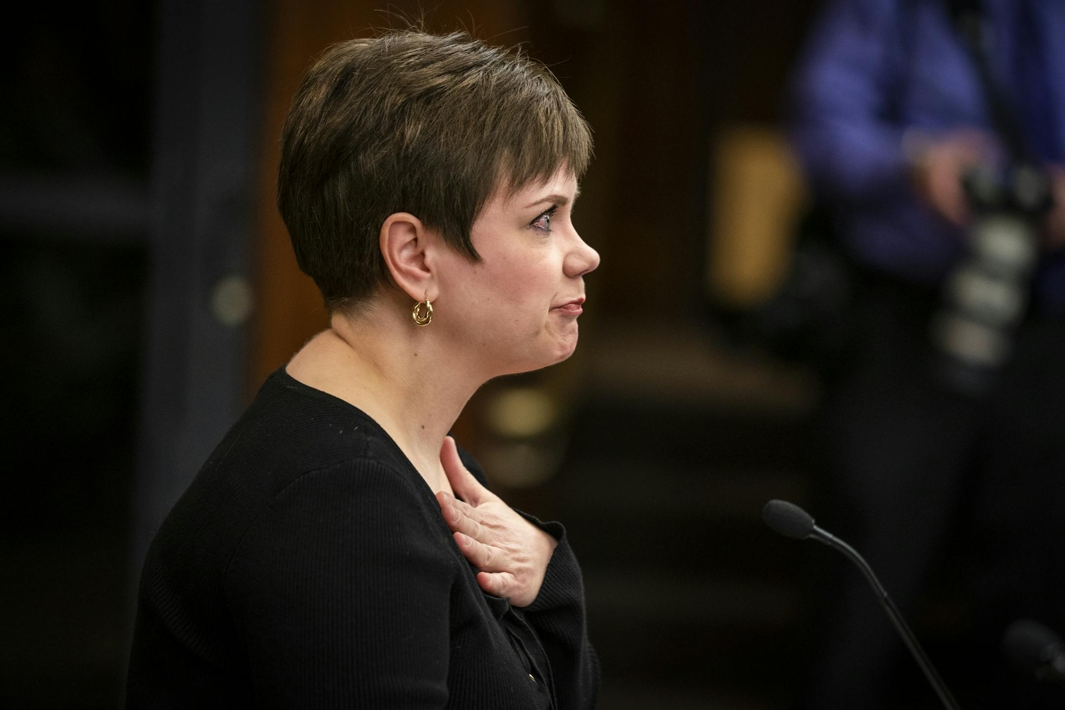 Jen Moeller, a former clinical instructor in the dental hygiene program at Argosy University, gets emotional while testifying.