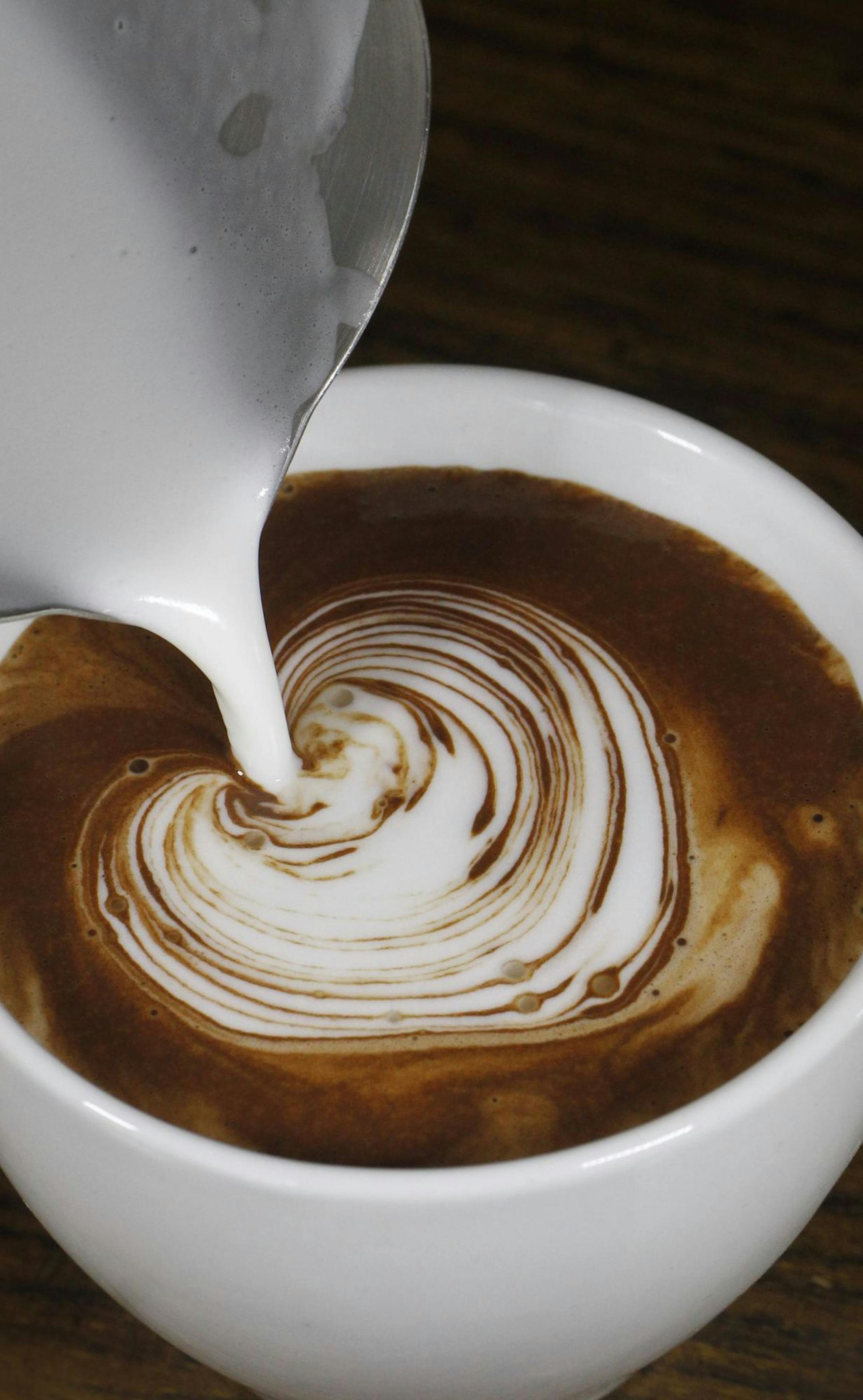 TOM WALLACE ‚Ä¢ twallace@startribune.com Assignments #20016459A_ Feb 09, 2011_ SLUG: rn0224 _ _ IN THIS PHOTO:] A how-to guide to preparing the best hot chocolate. Let‚Äôs give readers visual ideas of how to make a great cup of hot chocolate, with Kopplin's Cafe owner Andrew Kopplin sharing his knowledge. ORG XMIT: MIN2013012313071212