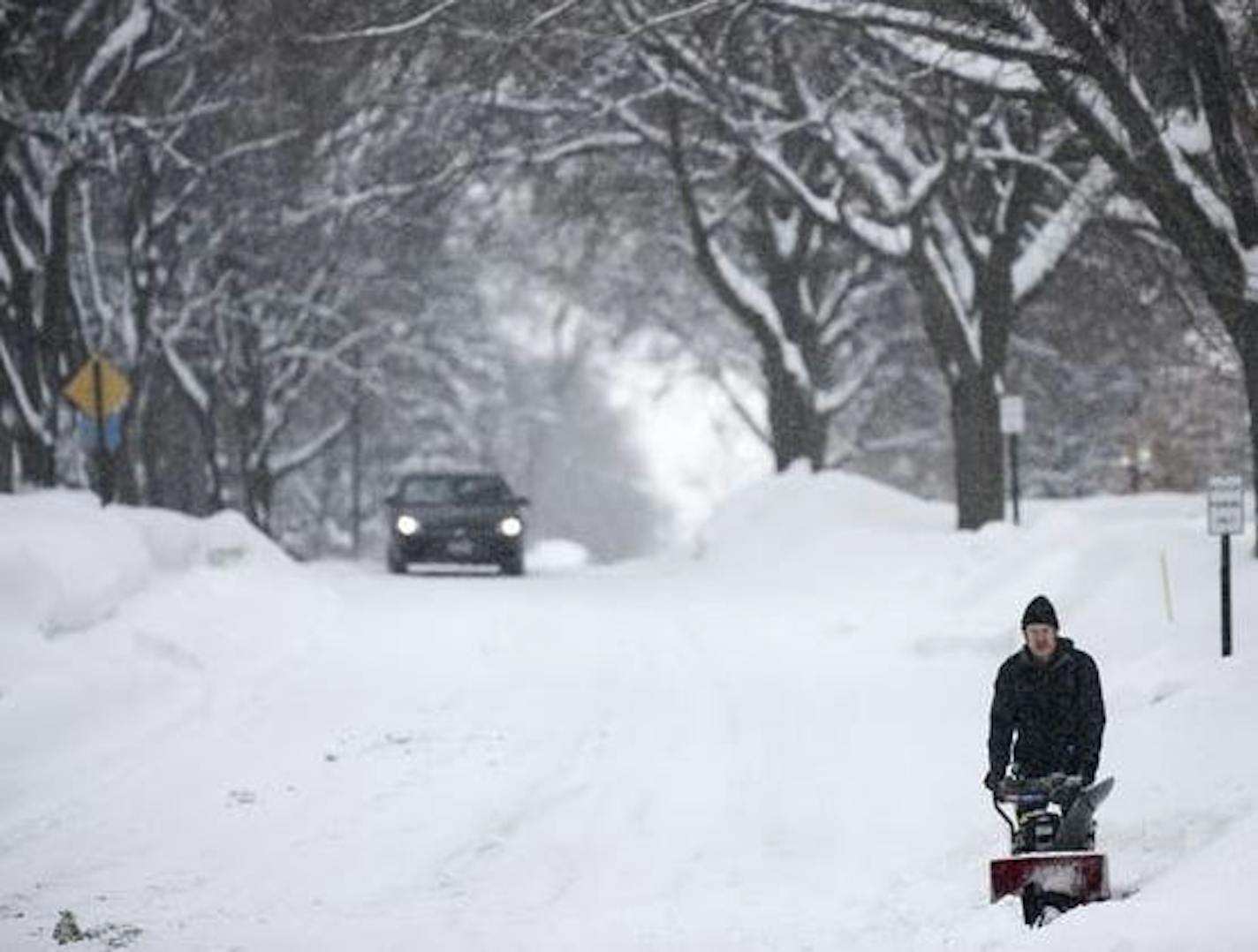 Joseph Poppy, of Robbinsdale, used a snowblower to remove snow from the front of his home during one of Feburary's many snowstorms.