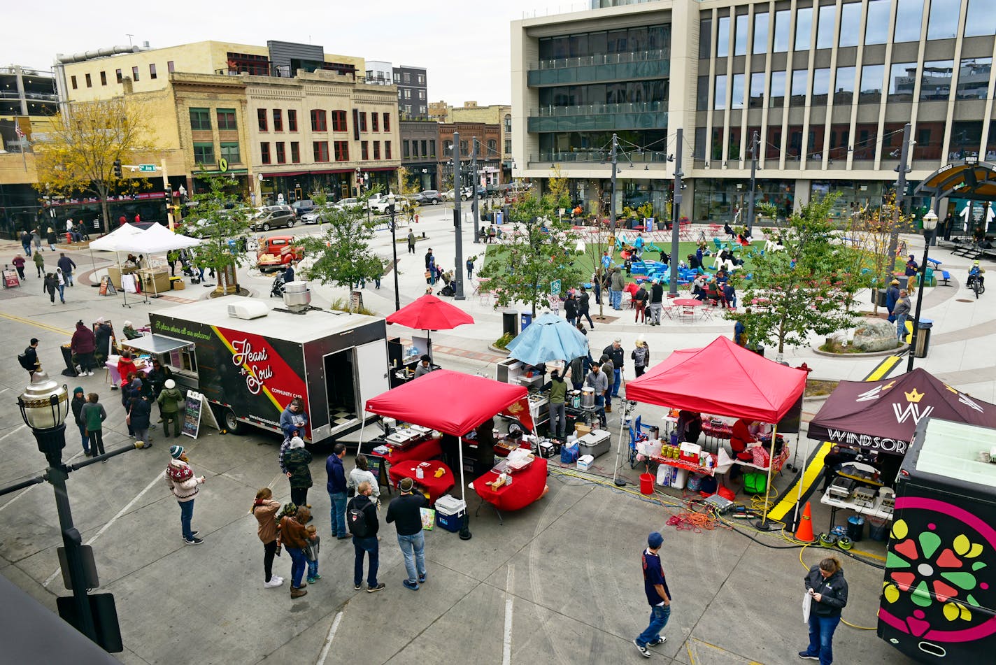 Broadway Square is surrounded by a mix of new and restored buildings in Fargo, N.D., Oct. 15, 2022. Visitors to the North Dakota town expecting a scene right out of the movie might be surprised by the James Beard-nominated chefs, Pride flags, hipster boutiques and craft breweries. (Dan Koeck/The New York Times)