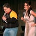 In this image provided by the U.S. Army, then-comedian Al Franken and sports commentator Leeann Tweeden perform a comic skit for service members durin