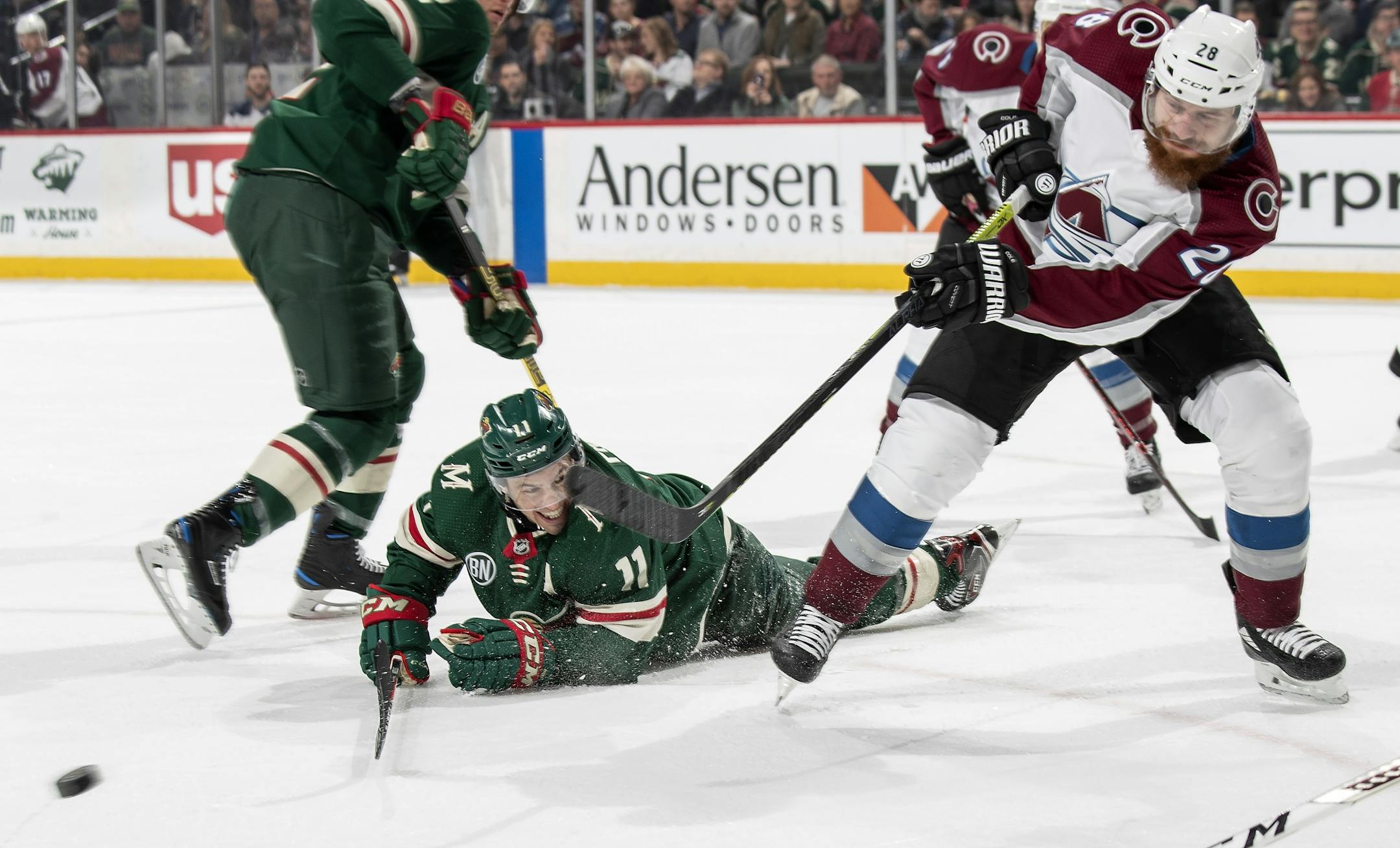 Zach Parise (11) and Ian Cole (28) fought for the puck in the first period.