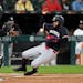 The Twins' Manuel Margot, right, slides by White Sox catcher Martín Maldonado to score on a single from Carlos Correa during the eighth inning Tuesda