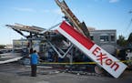 An Exxon gas station awning that collapsed during torrential rains from storms precipitated by Hurricane Ida, in the Queens borough of New York, Sept.