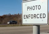 In this Nov. 12, 2013 photo is a highway sign warning motorists along Interstate 380 in Cedar Rapids, Iowa that the speed limit is enforced by cameras. New state rules to rein in the use of speed cameras after their rapid expansion have set off a furor in municipalities that reflects how prized the cameras have become in many cities and how important they are to their budgets.