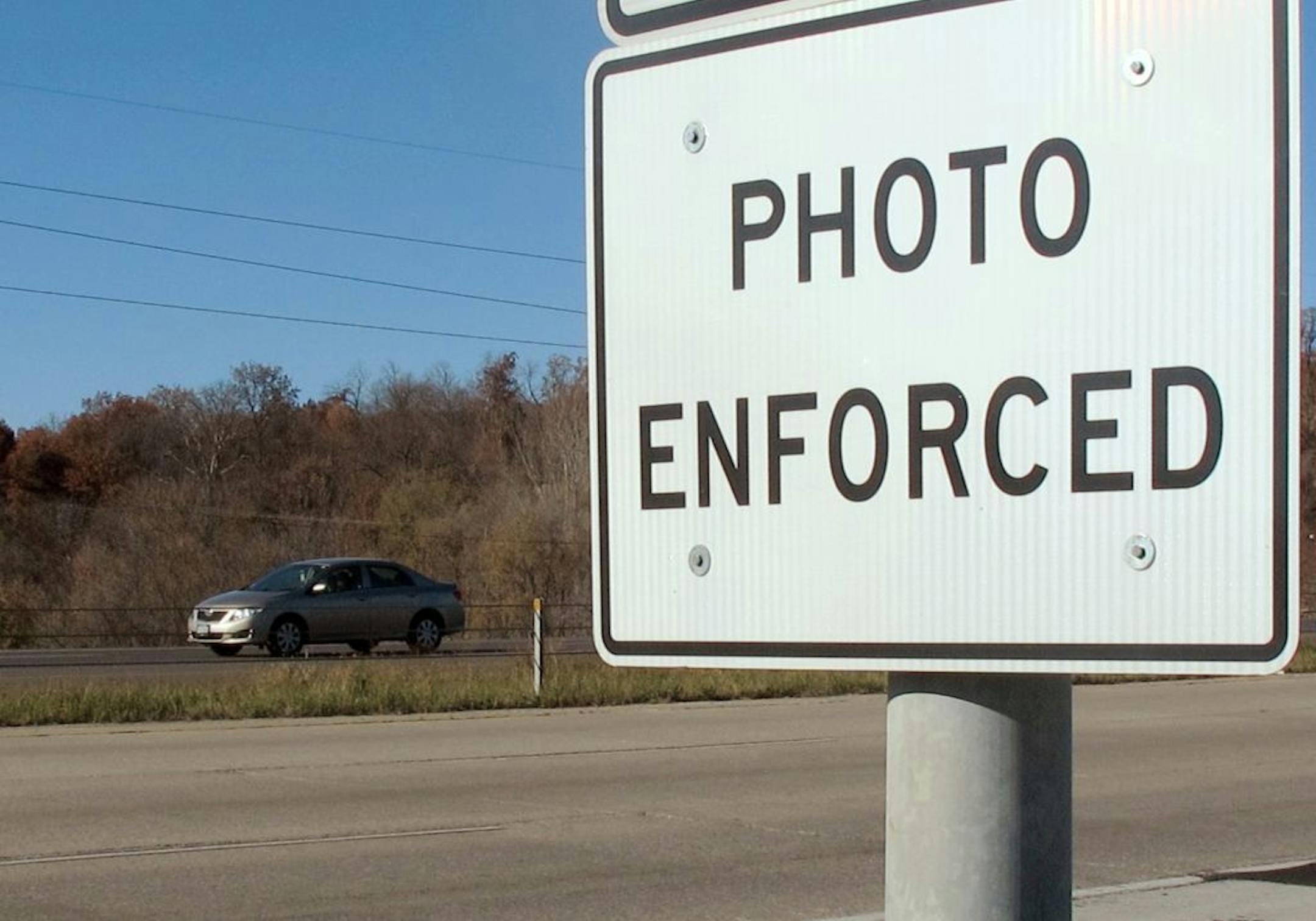 In this Nov. 12, 2013 photo is a highway sign warning motorists along Interstate 380 in Cedar Rapids, Iowa that the speed limit is enforced by cameras. New state rules to rein in the use of speed cameras after their rapid expansion have set off a furor in municipalities that reflects how prized the cameras have become in many cities and how important they are to their budgets.