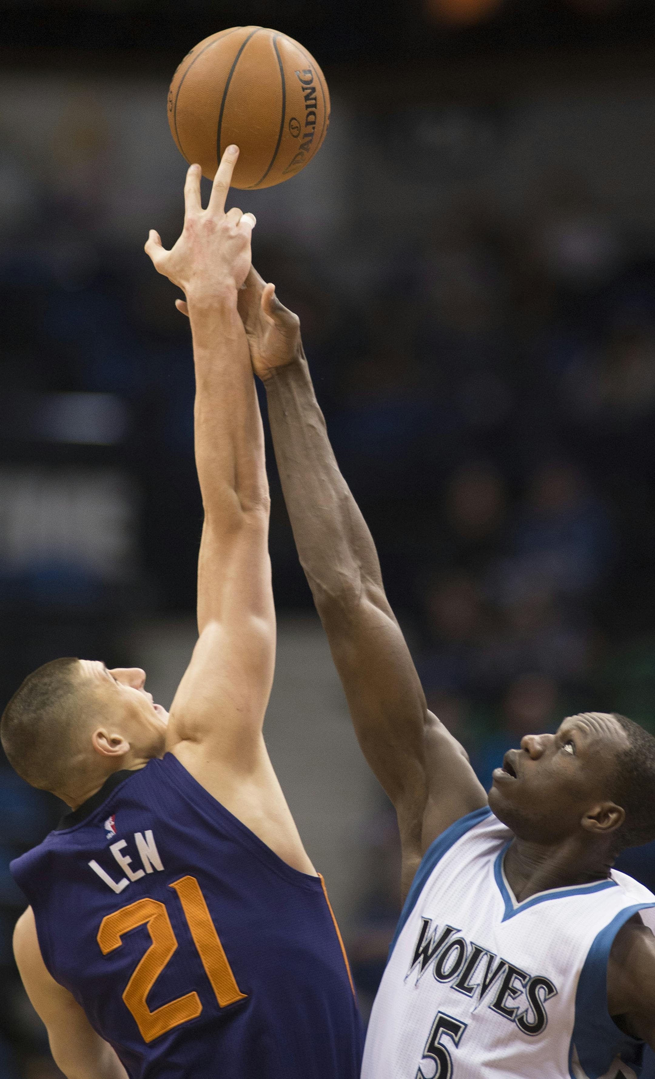 Minnesota Timberwolves center Gorgui Dieng (5) and Phoenix Suns center Alex Len (21) go up for the tip off to start Wednesday night's game at Target Center. ] (Aaron Lavinsky | StarTribune) The Minnesota Timberwolves play the Phoenix Suns Wednesday, Jan. 7, 2014 at Target Center in Minneapolis.