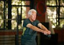 Shot of a senior man working out with a kettle bell at the gym. istock.