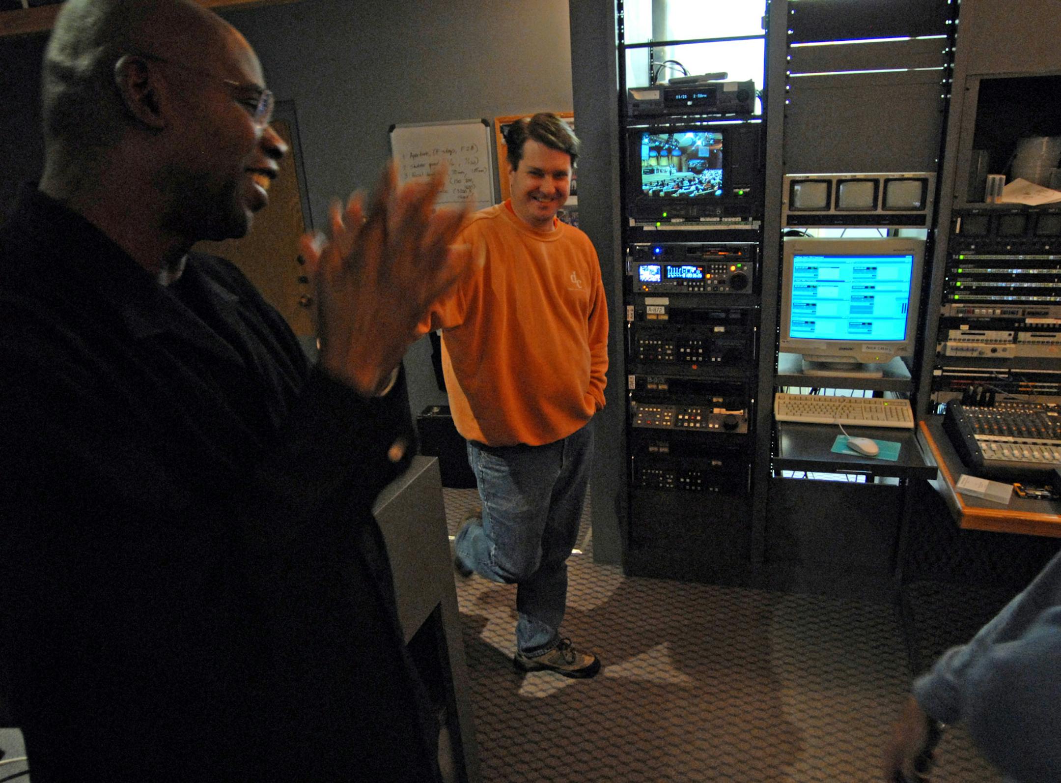 The Rev. Randy Morrison, left, of the Speak the Word Church in Golden Valley with Sean Cline, director of television operations at the church, in the control room that Morrison designed.