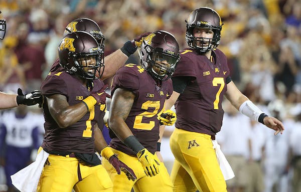Minnesota's running back Rodney Smith was congratulated by his teammates after a touchdown during the third quarter against TCU.