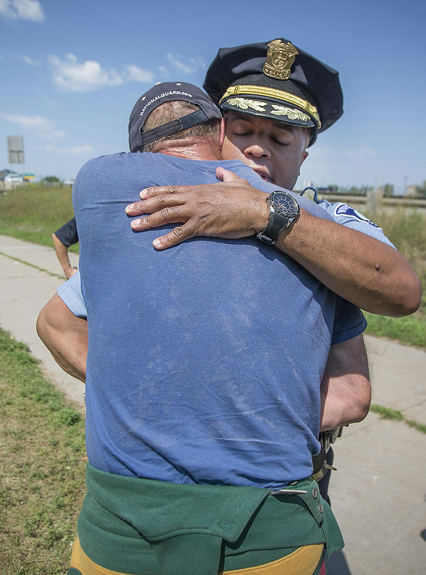 Minneapolis Police Chief Medaria Arradondo, center, and Minneapolis Mayor Jacob Frey, visited a homeless encampment near 16th Avenue South & East Franklin Avenue Wednesday, August 8, 2018 in Minneapolis, MN. ] ELIZABETH FLORES &#xef; liz.flores@startribune.com