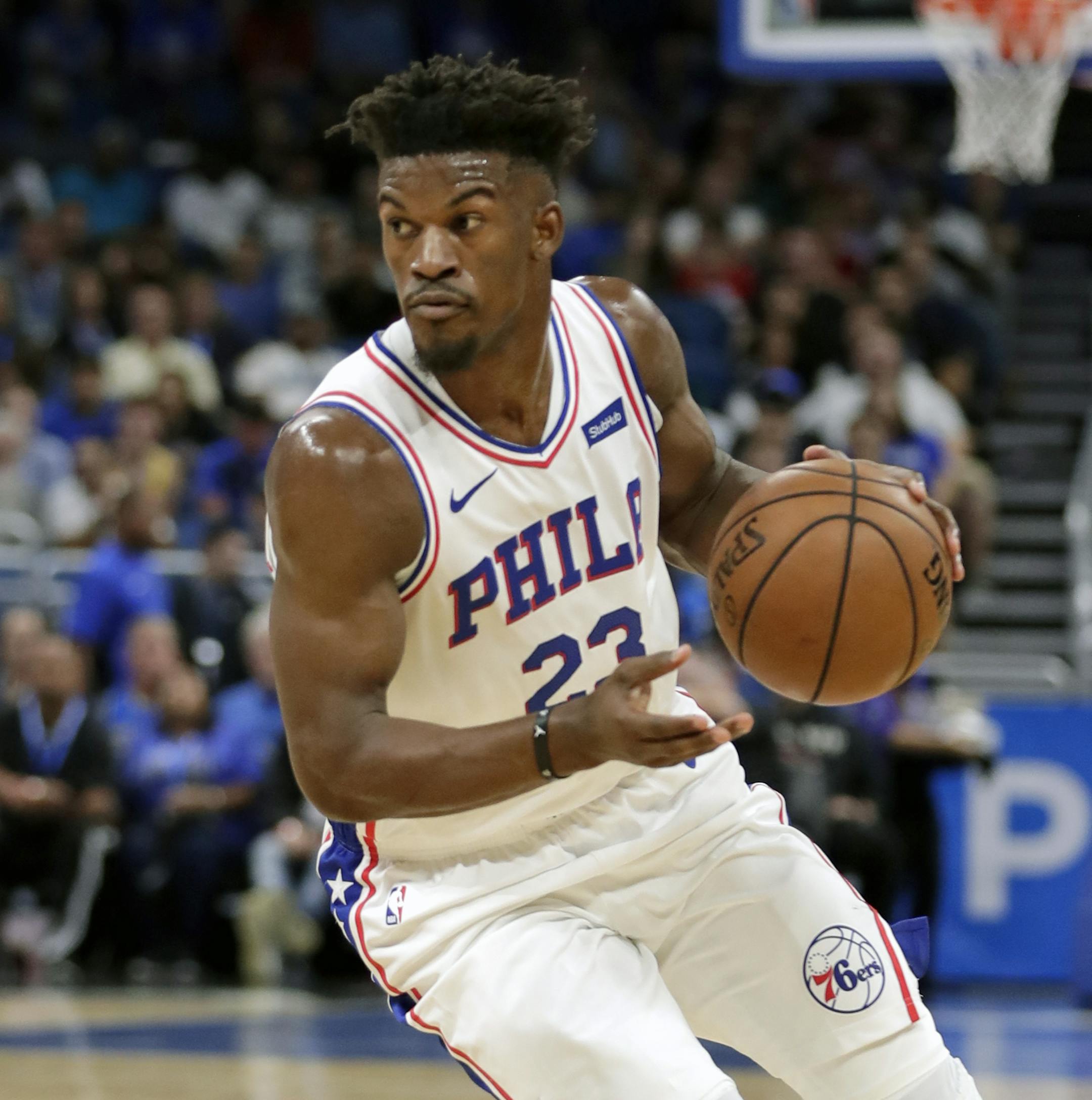 Philadelphia 76ers' Jimmy Butler moves the ball against the Orlando Magic during the first half of an NBA basketball game, Wednesday, Nov. 14, 2018, in Orlando, Fla. (AP Photo/John Raoux)