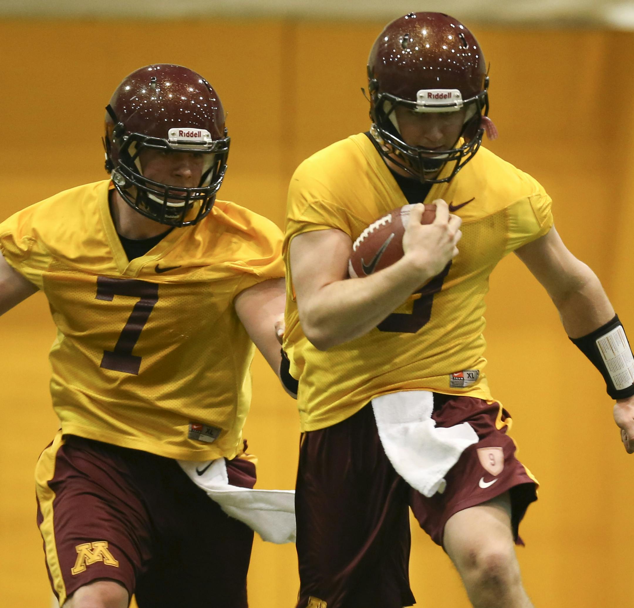 The University of Minnesota football team held their first day of spring practice indoors at the Gibson-Nagurski Football Complex Tuesday afternoon, March 26, 2013 in Minneapolis, Minn. Likely starting quarterback Philip Nelson hung onto the ball while his possible backup, Mitch Leidner, tried to strip him of it during a drill in practice Tuesday afternoon. ] JEFF WHEELER ‚Ä¢ jeff.wheeler@startribune.com
